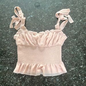 aritzia baby pink extra small (XS) top with ruffles and ties to the top